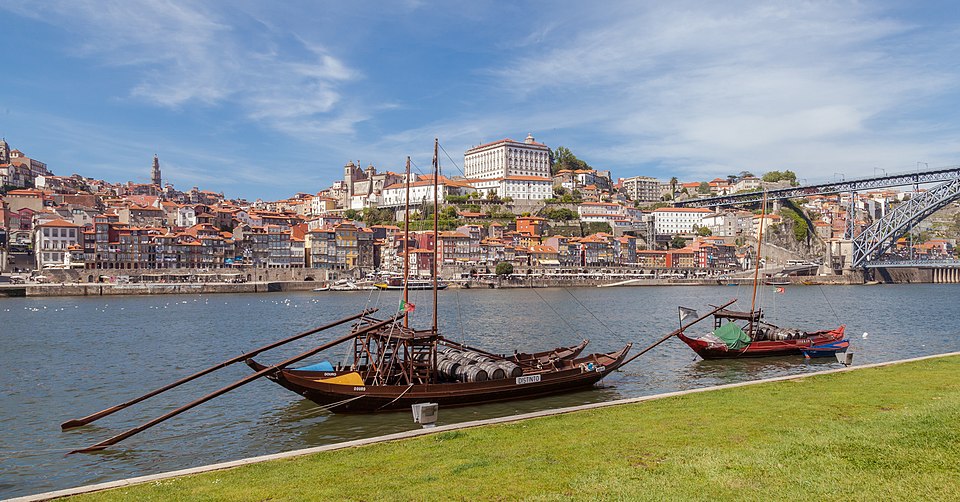 Multiple rabelo boats moored on the Douro River in Vila Nova de Gaia