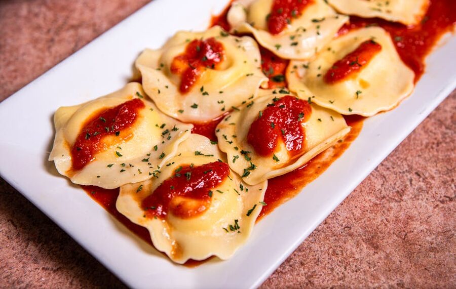 Italian ravioli in tomato sauce with herbs