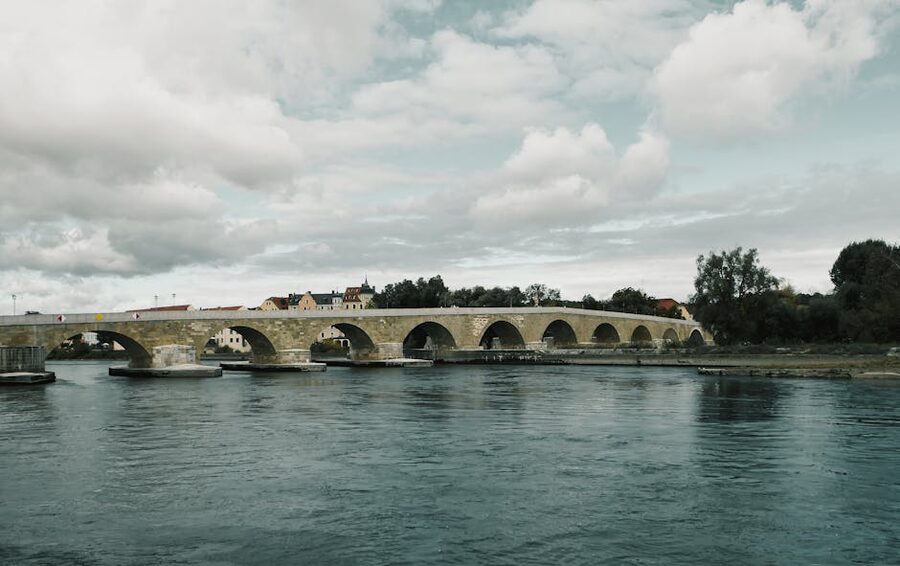 Ancient stone bridge crossing the Danube River in Regensburg