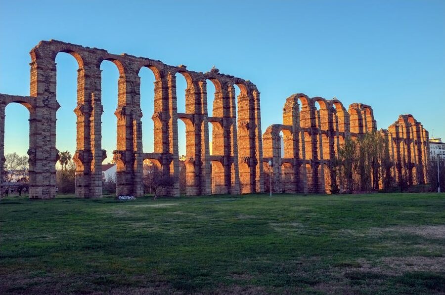 Roman aqueduct ruins golden hour