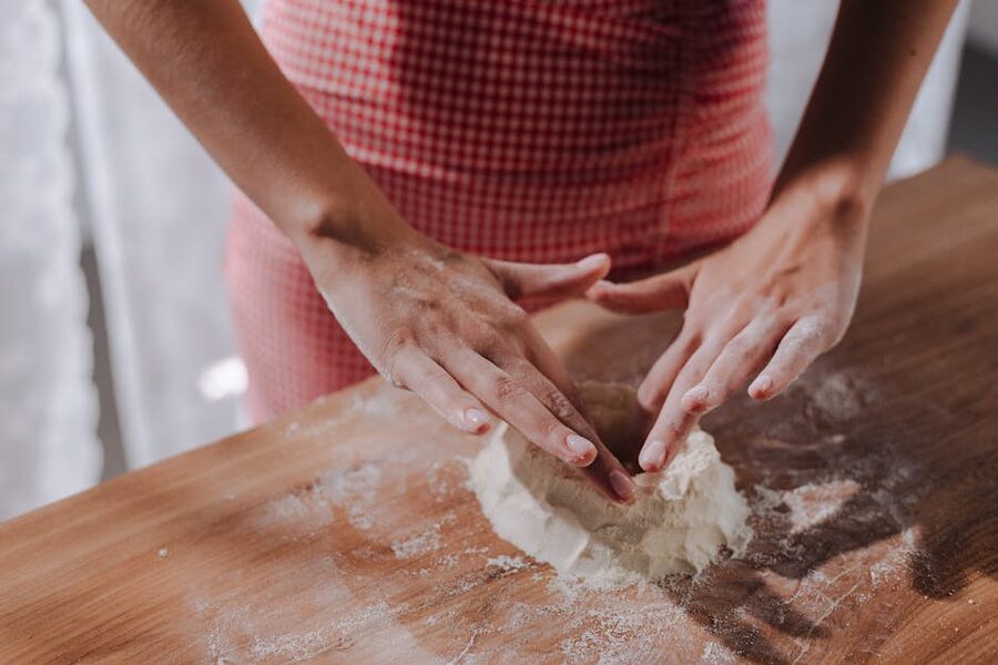 Rome cooking class student shaping pasta dough