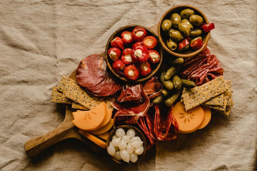 Rustic charcuterie board with cheeses meats and crackers