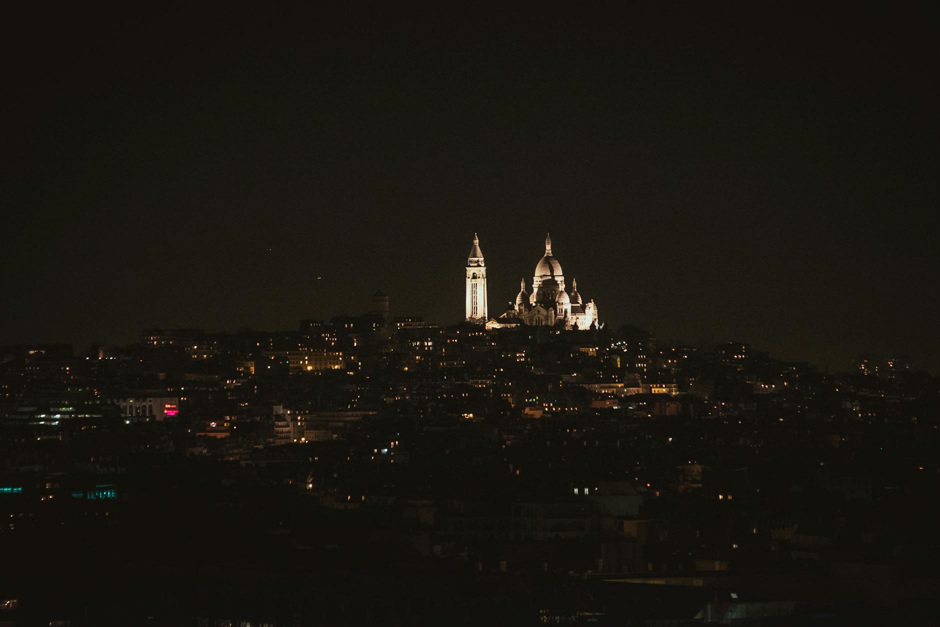 Illuminated Sacré-Coeur Basilica at night in Montmartre, Paris