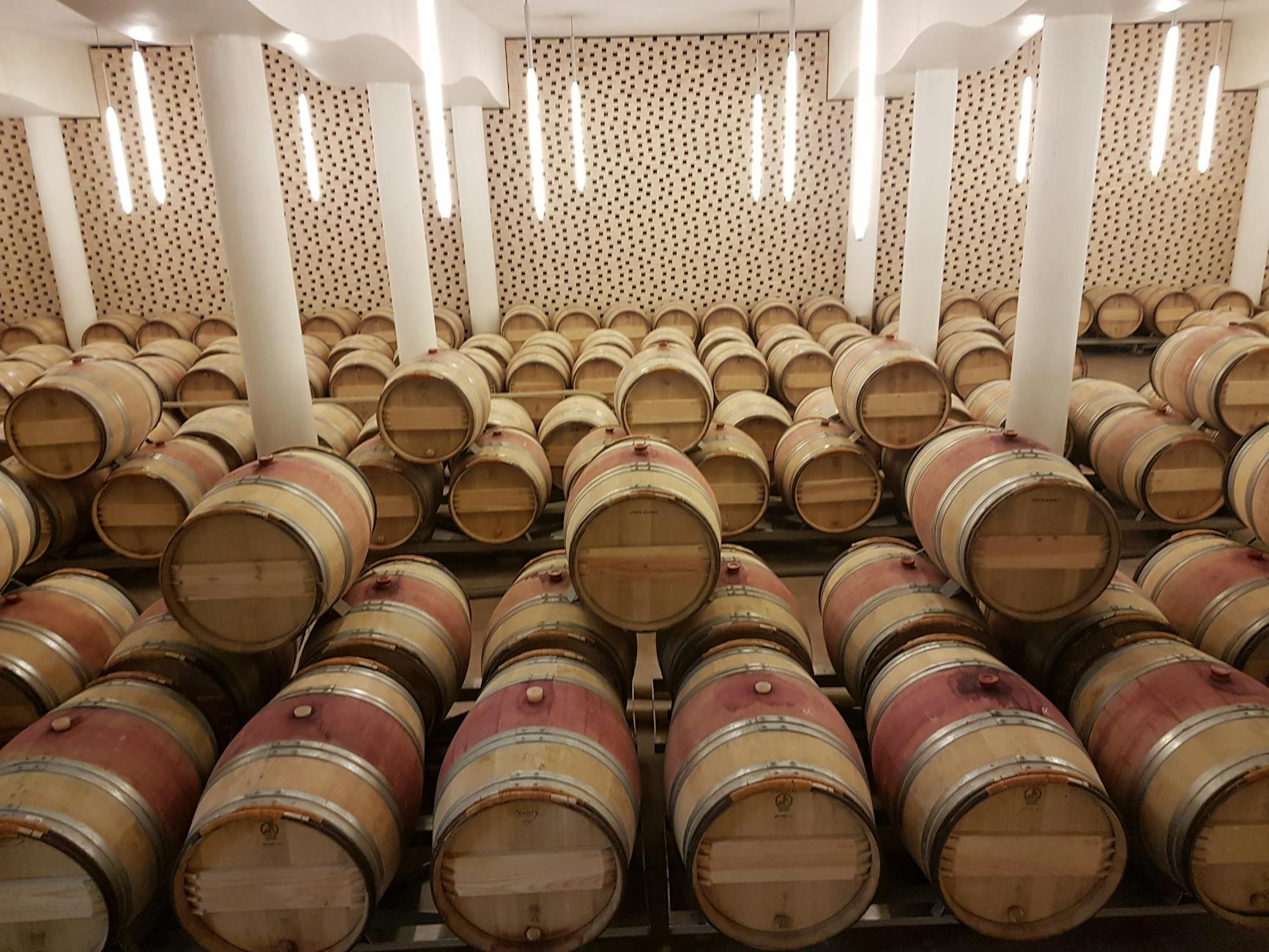 Wooden wine barrels in a Saint-Émilion cellar