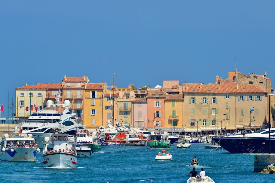 Elegant yachts in the harbour of Saint-Tropez under clear blue sky