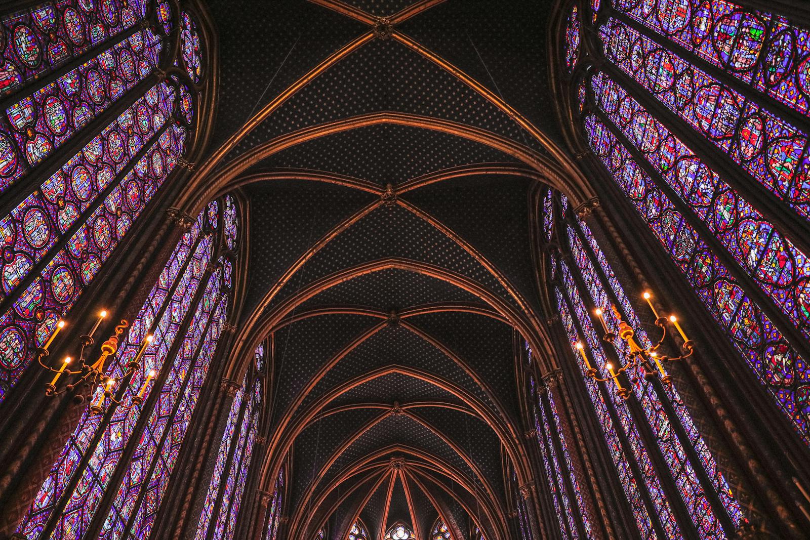 Gothic arches and stained-glass windows inside Sainte-Chapelle Paris