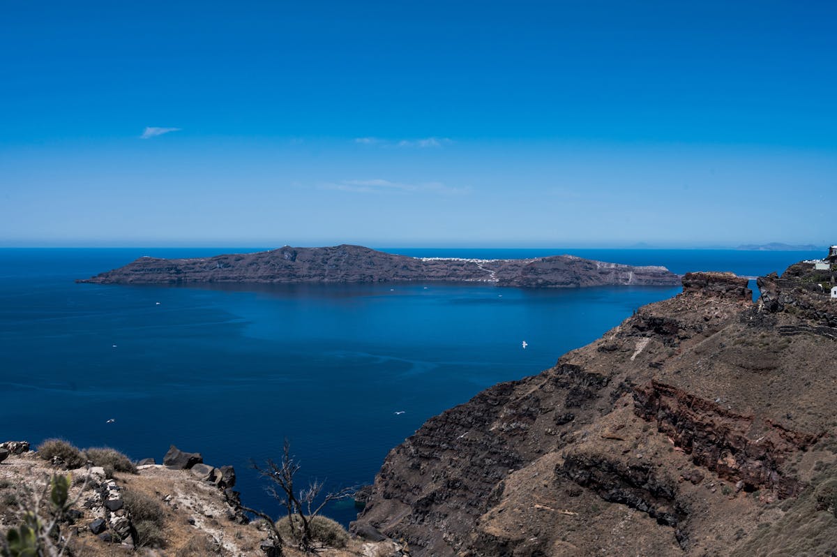 Aerial view of the Santorini caldera surrounded by azure Mediterranean waters
