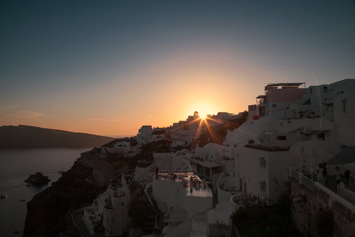 Sunset view of Santorini's white architecture on cliffs