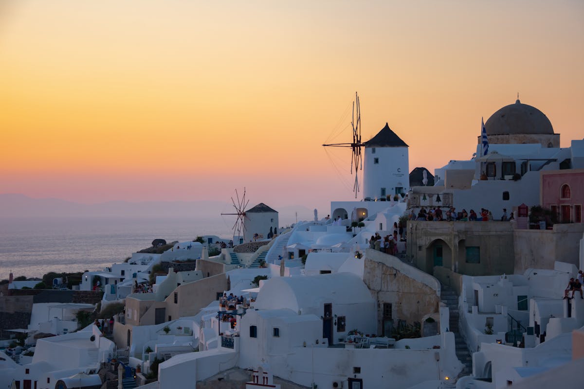 Stunning sunset in Santorini with windmills and white architecture