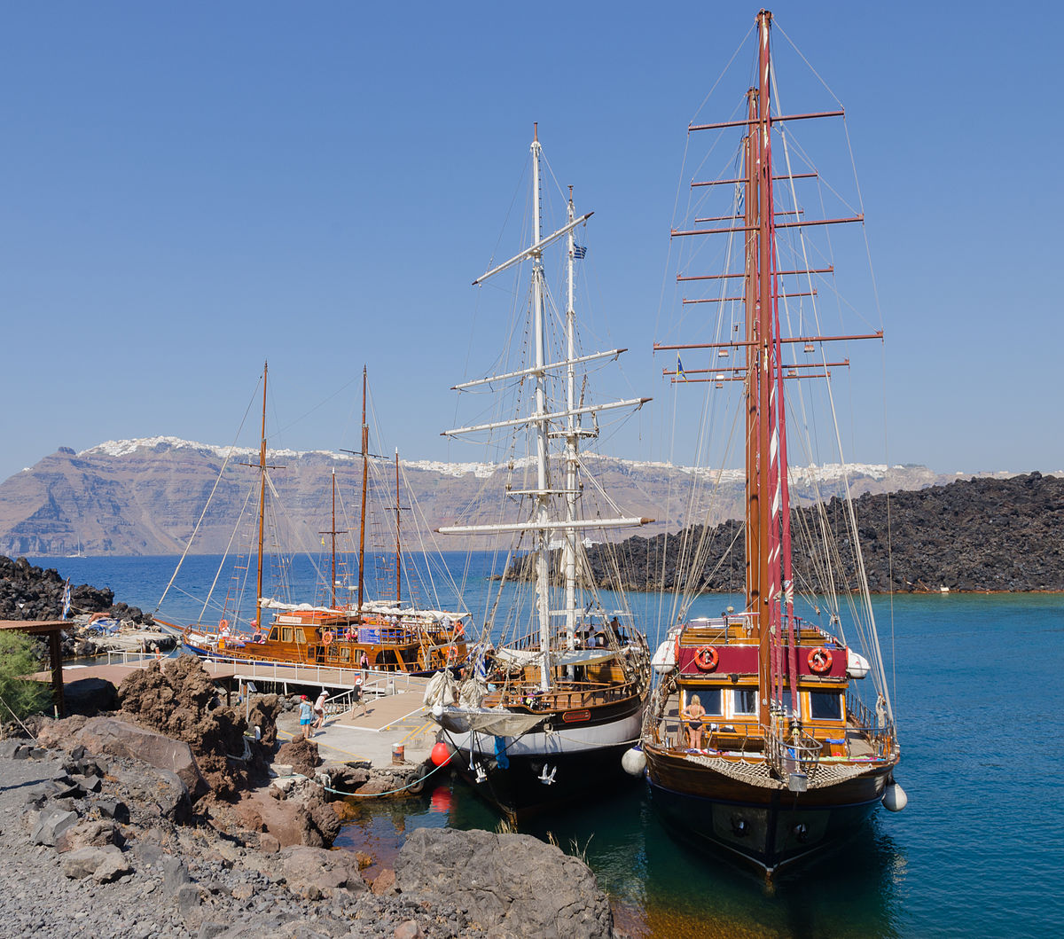 Tour boats near Nea Kameni volcanic island in Santorini
