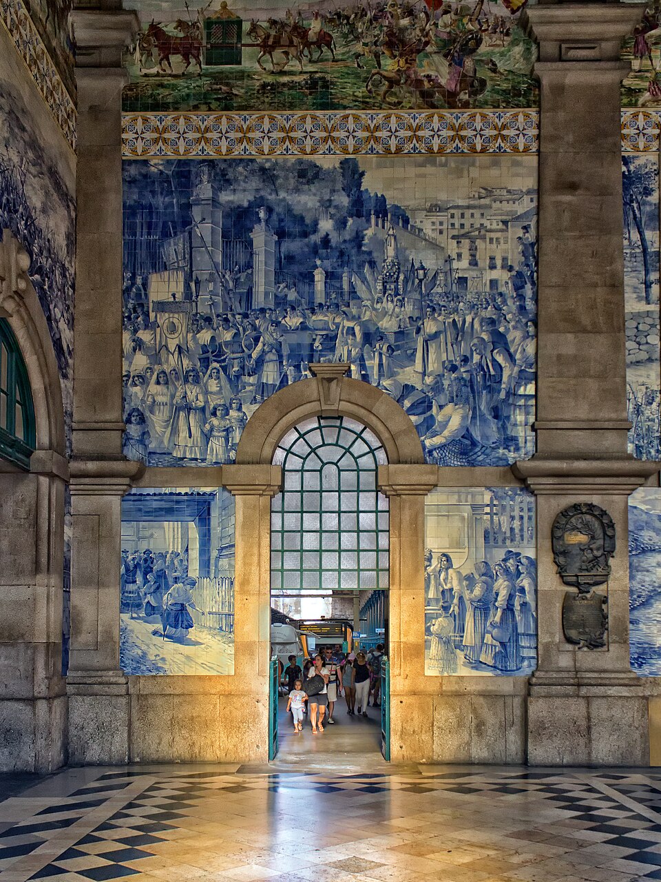 Hand-painted azulejo tiles covering the walls of São Bento railway station in Porto