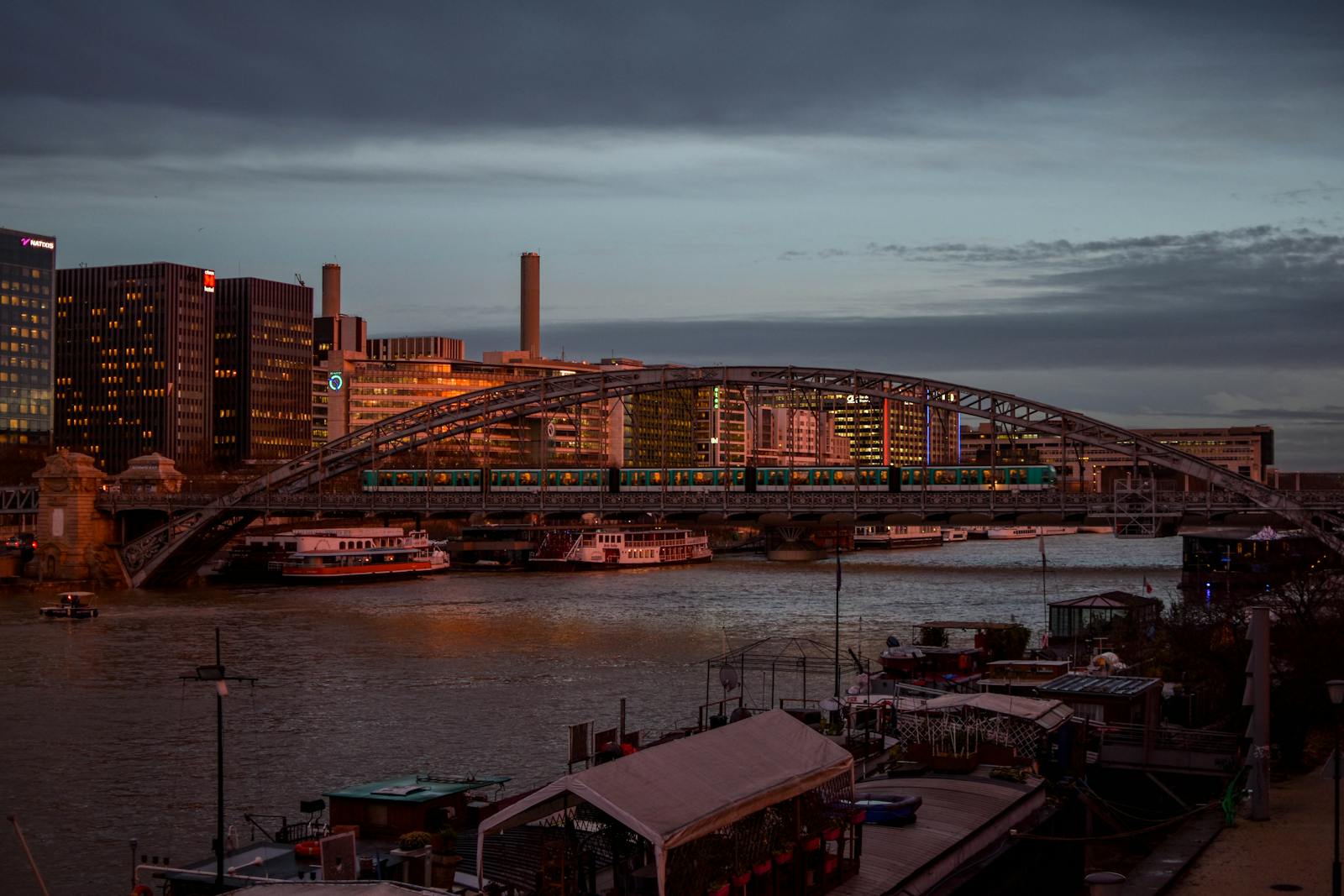 Picturesque view of a bridge over the Seine in Paris during evening twilight
