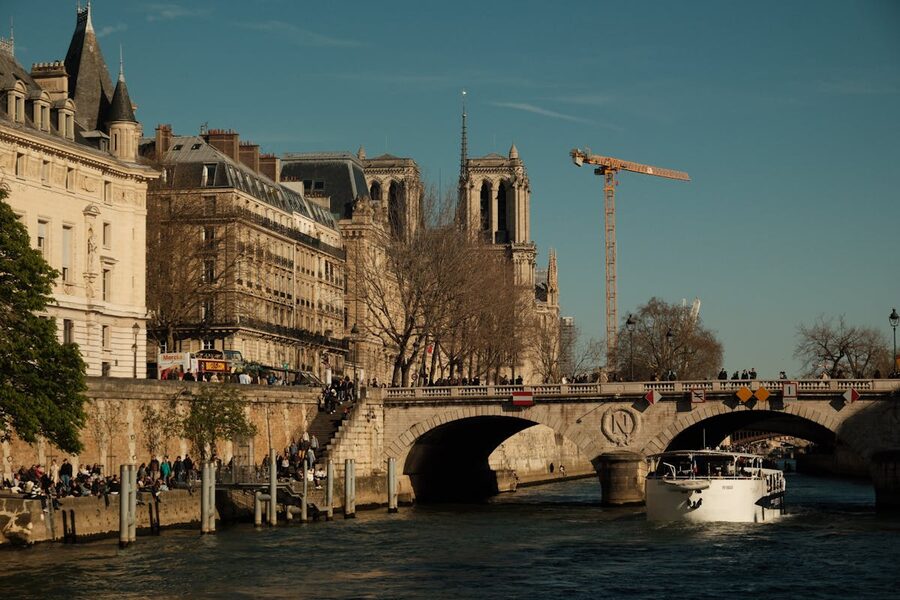 Notre Dame Cathedral beside the Seine River on a sunny day in Paris