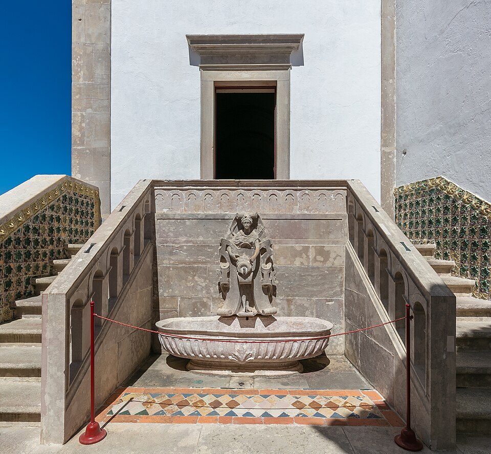 Twin conical chimneys of Sintra National Palace rising above the town