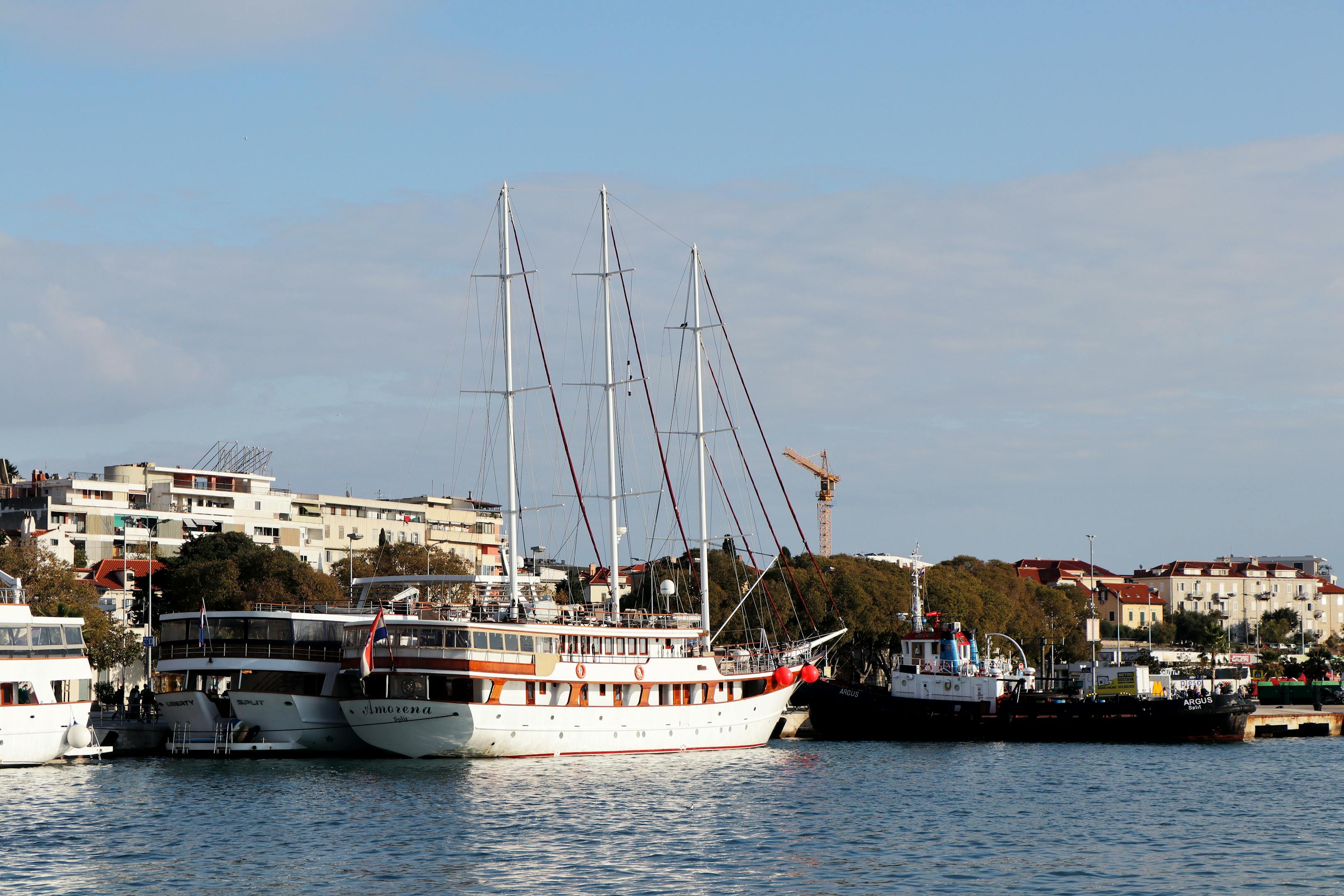 Idyllic view of sailboats docked in Split, Croatia, under clear skies