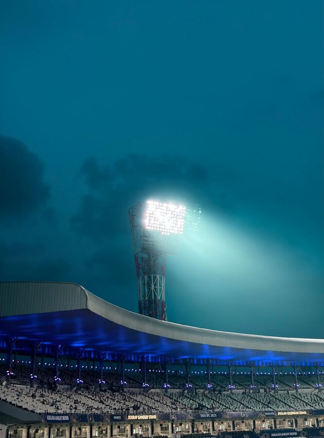 Stadium floodlights illuminated at night