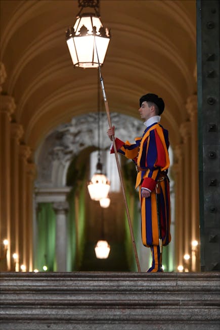 Swiss Guard in traditional uniform at Vatican entrance