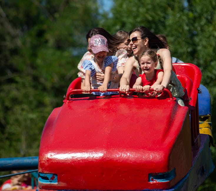 Families experiencing theme park ride