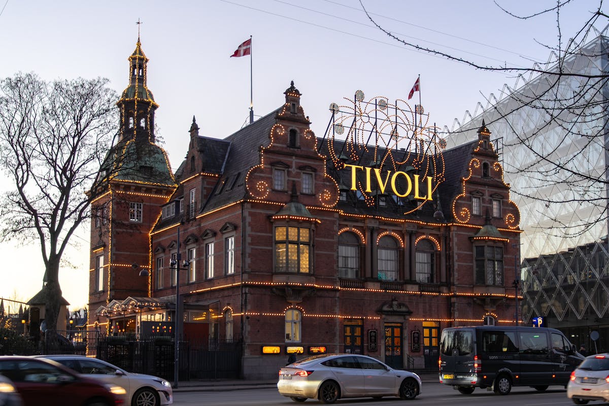 Tivoli Gardens illuminated facade at twilight in Copenhagen