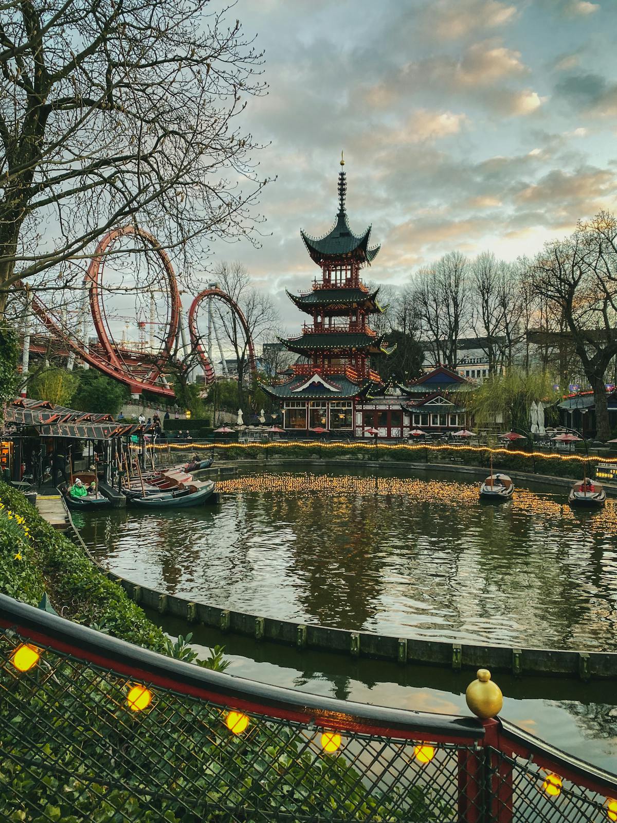 Tivoli Gardens pagoda and pond at dusk with vibrant reflections in Copenhagen