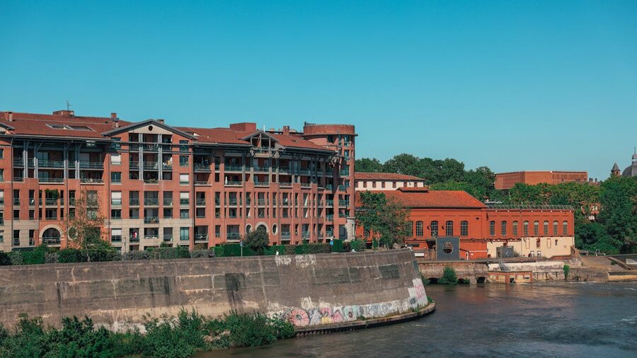 Brick buildings along the river in Toulouse