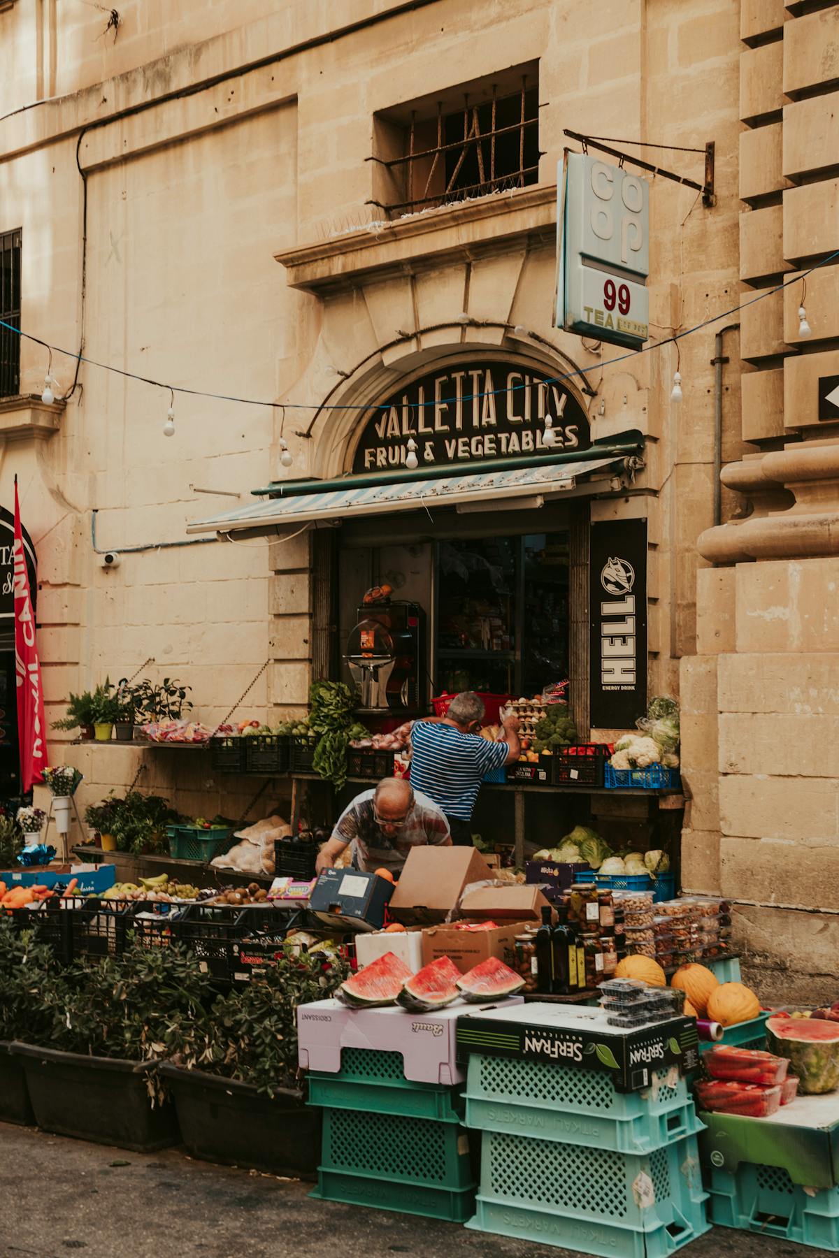 Colourful fruit and vegetable market stall in Valletta displaying local Maltese produce