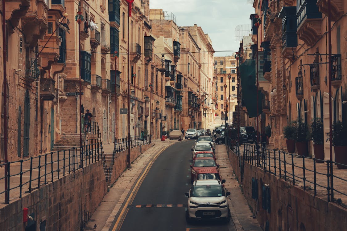 Historic limestone street in Valletta with traditional architecture