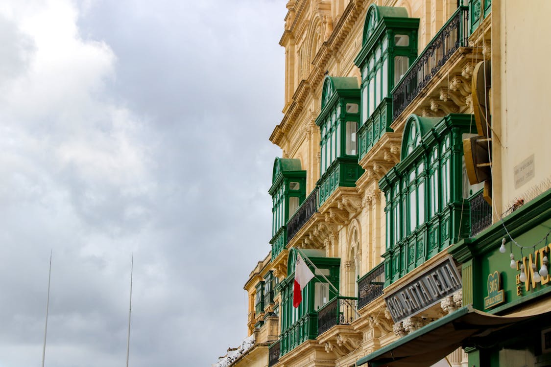 Colourful traditional Maltese enclosed balconies on a Valletta building