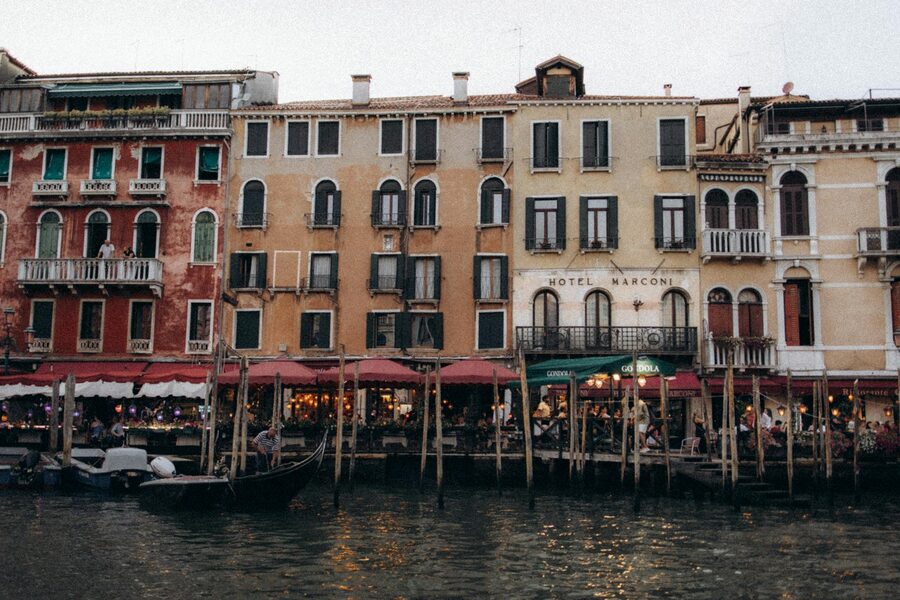 Venice canals with gondolas and colorful buildings