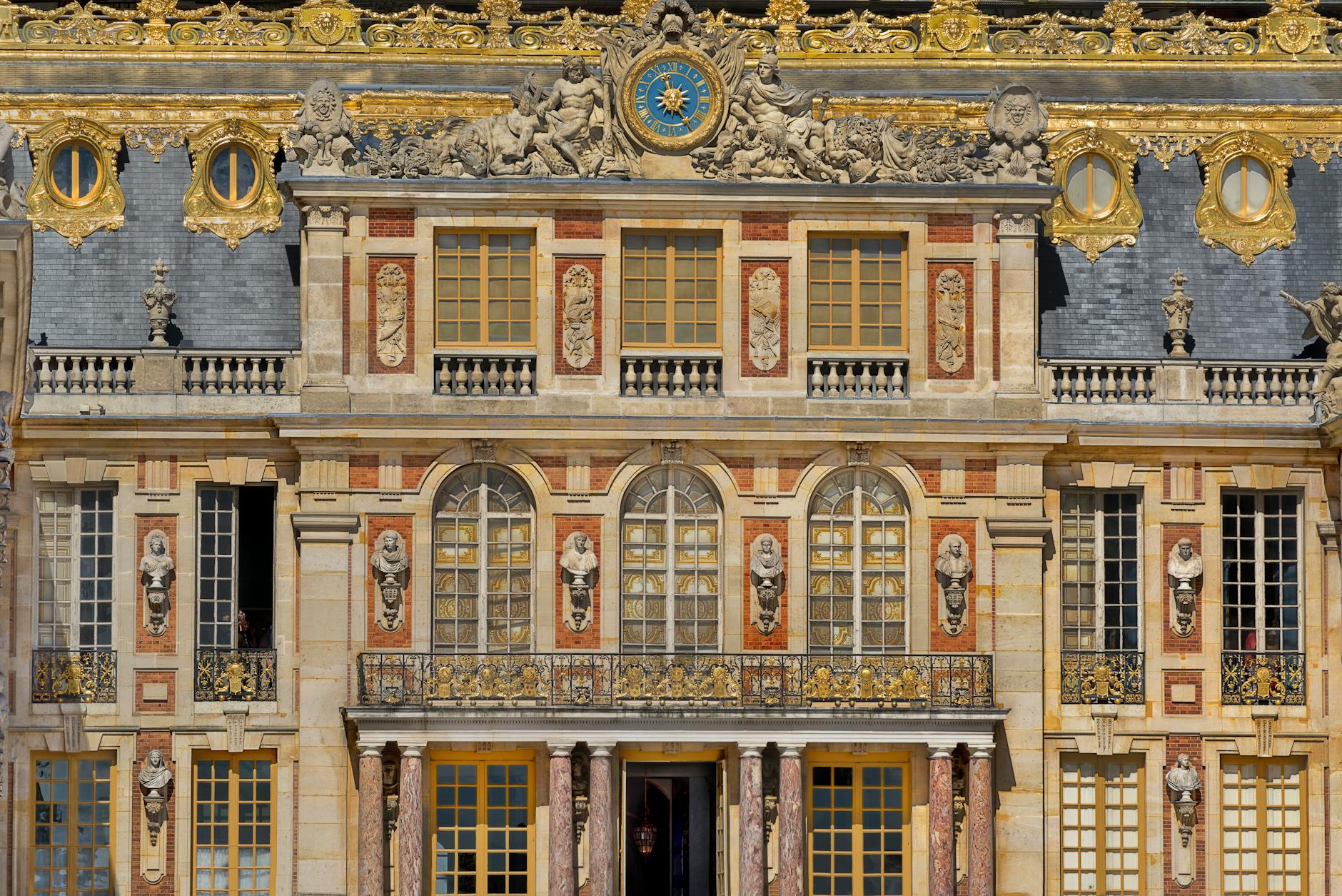 Close-up of the ornate Baroque facade of the Palace of Versailles
