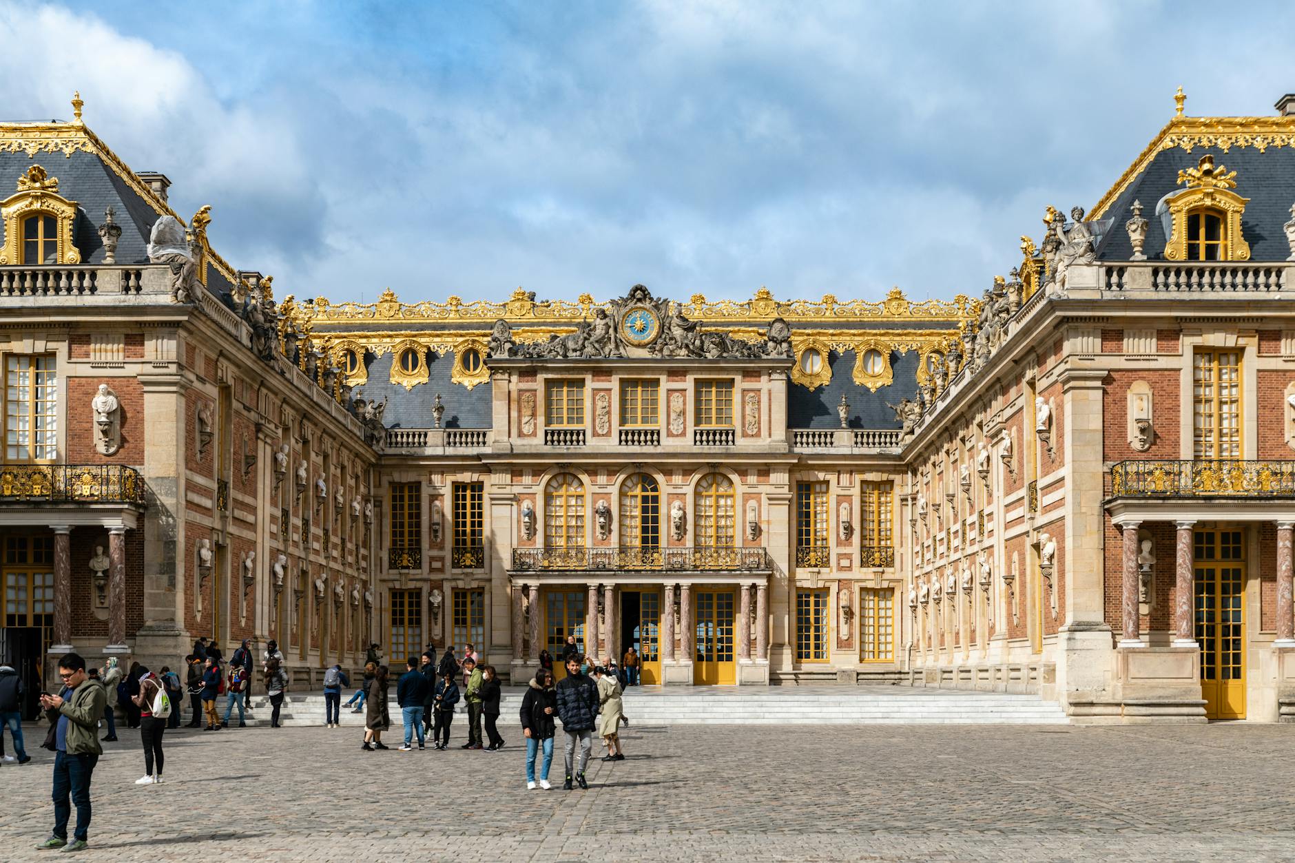 The grand Baroque exterior of the Palace of Versailles