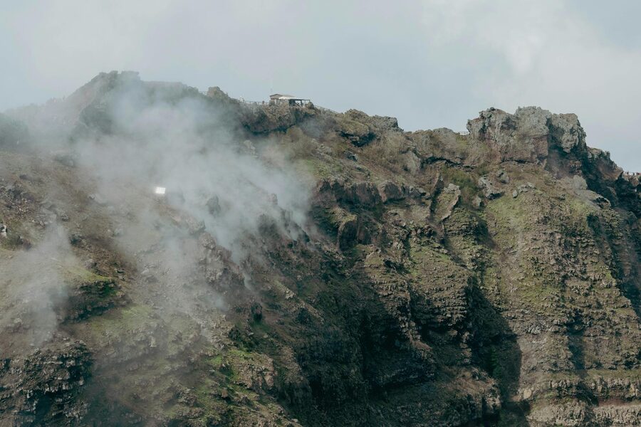Vesuvius rugged terrain with mysterious clouds