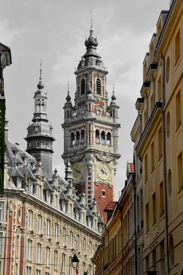 Street in Vieux Lille with Flemish architecture and belfry in the background