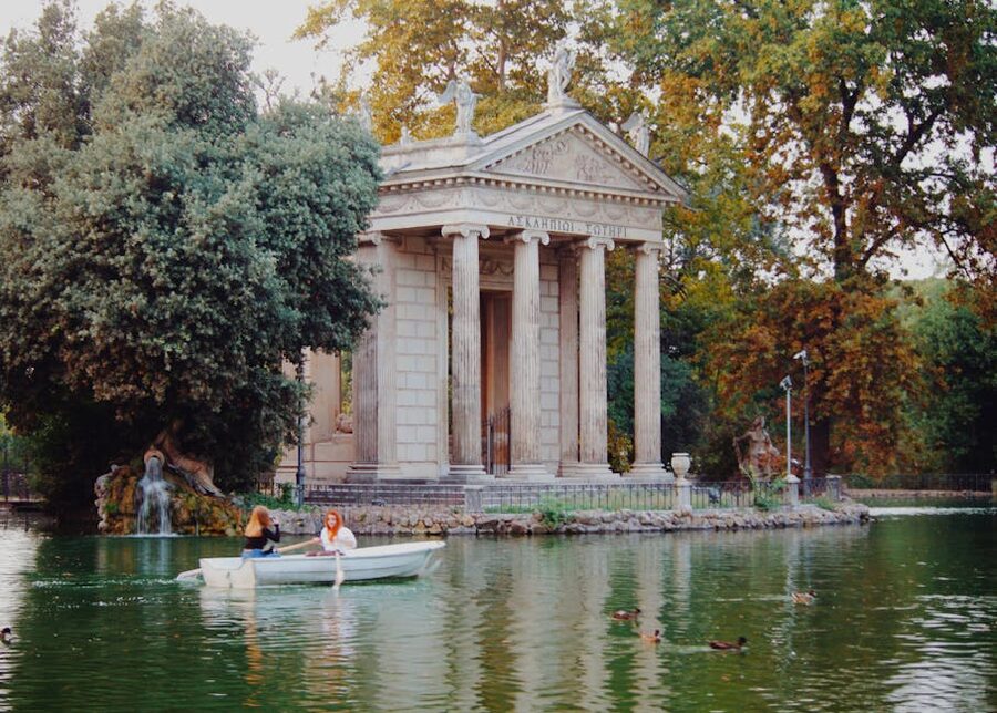 Rowboat on Villa Borghese lake by temple