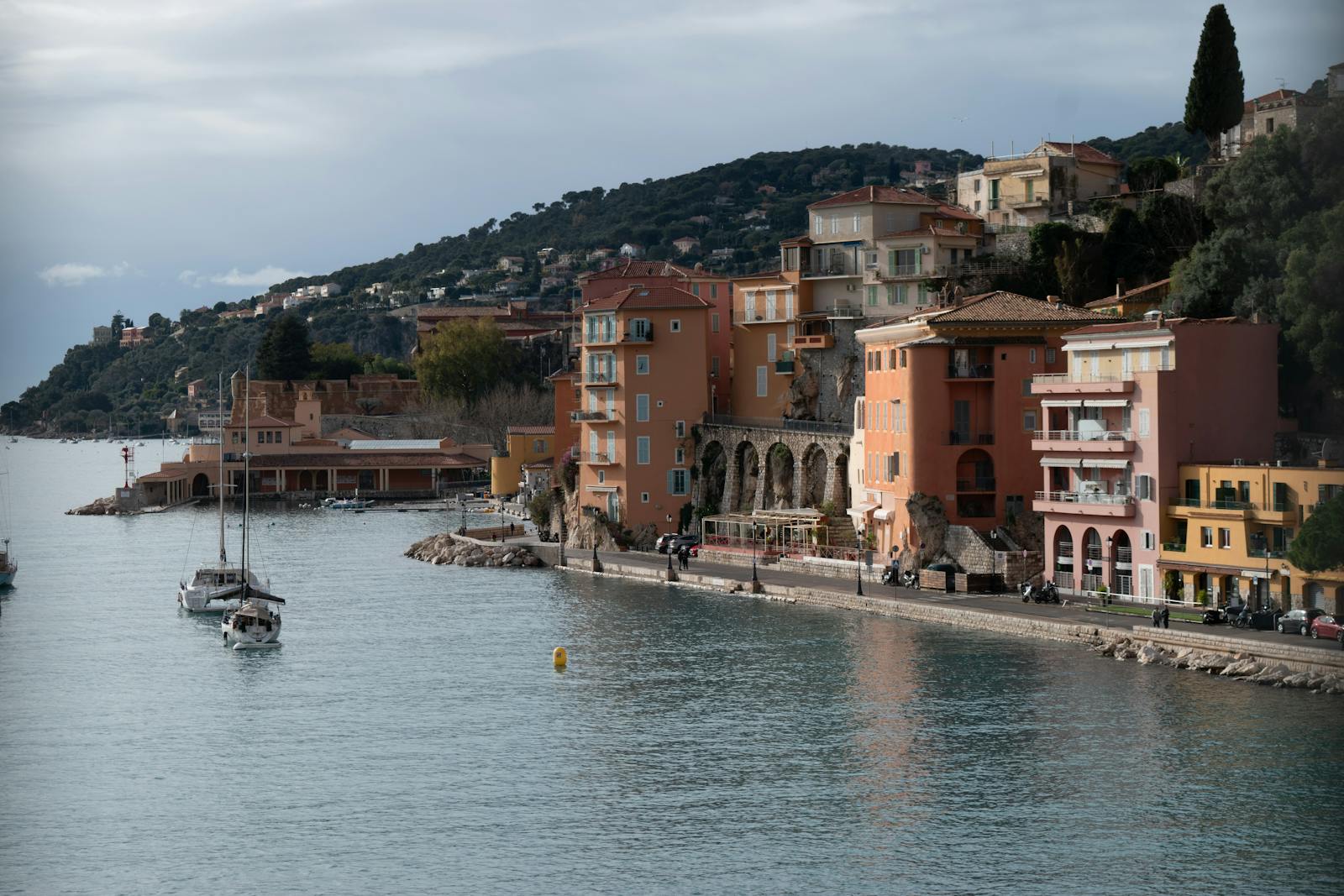 Picturesque coastal view of Villefranche-sur-Mer with colorful buildings and calm waters
