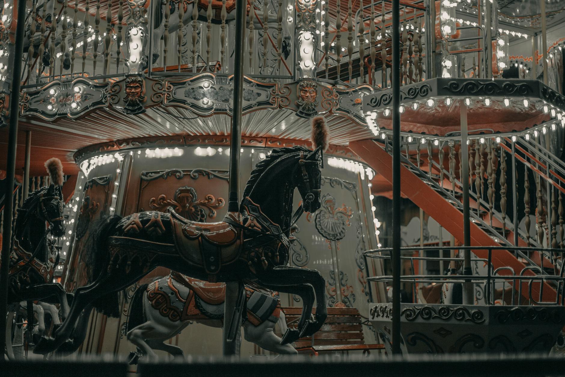 Vintage carousel lit up at night in a theme park