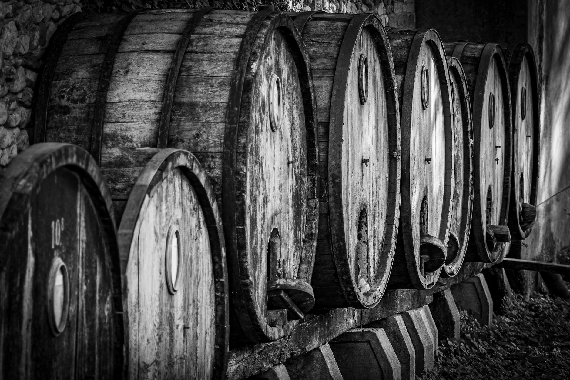 Vintage wine barrels in a rustic cellar