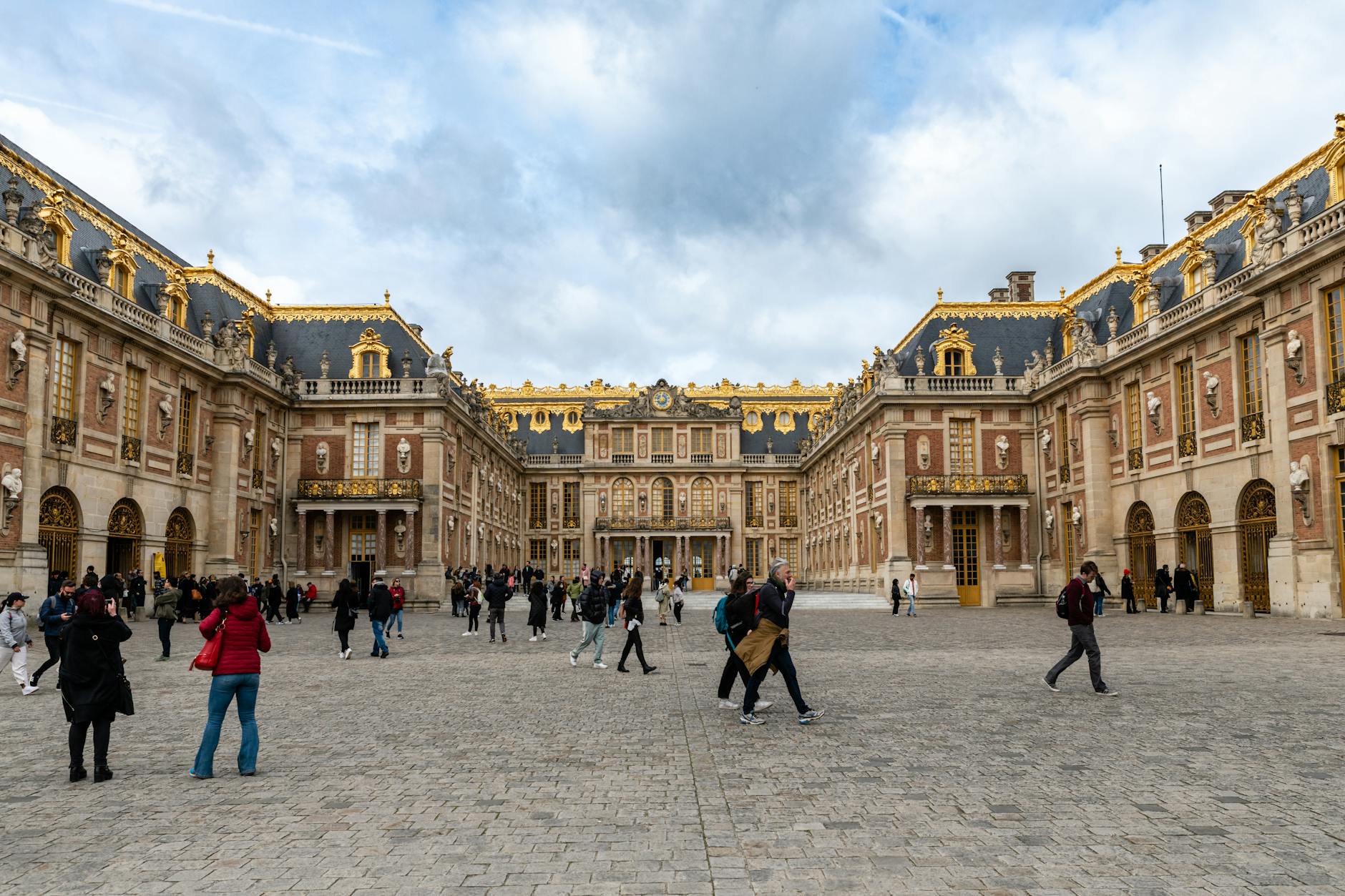 Visitors exploring the Palace of Versailles UNESCO World Heritage site