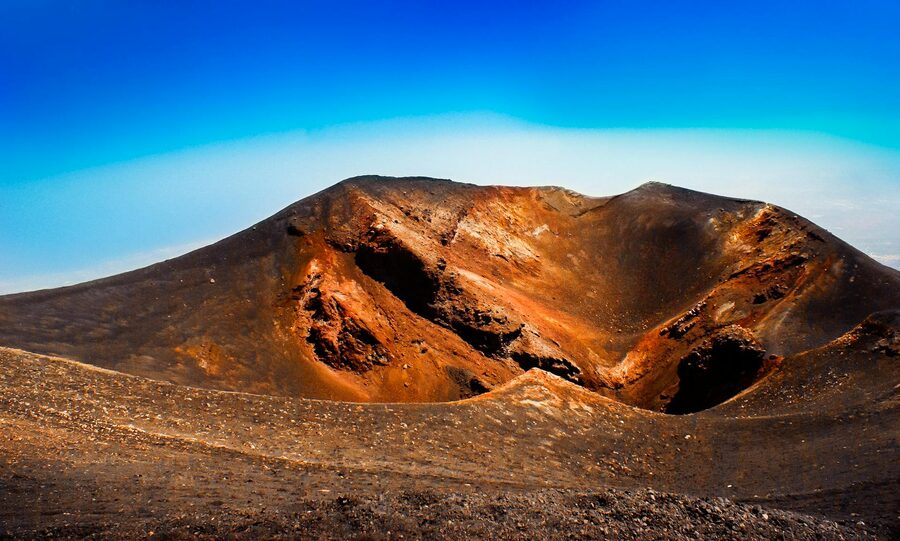 Volcanic crater landscape with colored mineral deposits in Sicily