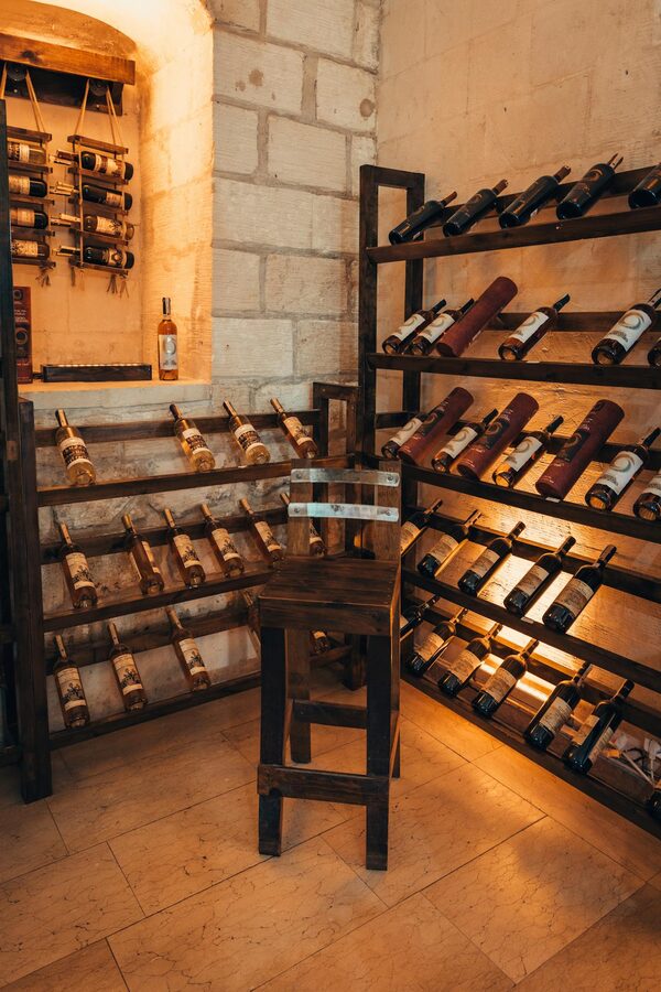 Warm inviting wine cellar with wooden racks and ambient lighting