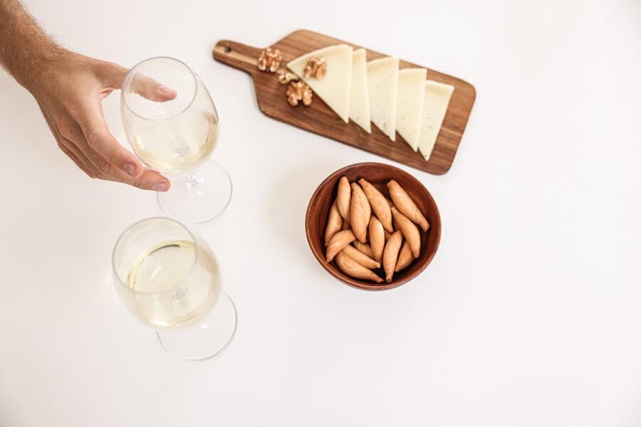 Italian aperitivo with wine cheese and breadsticks