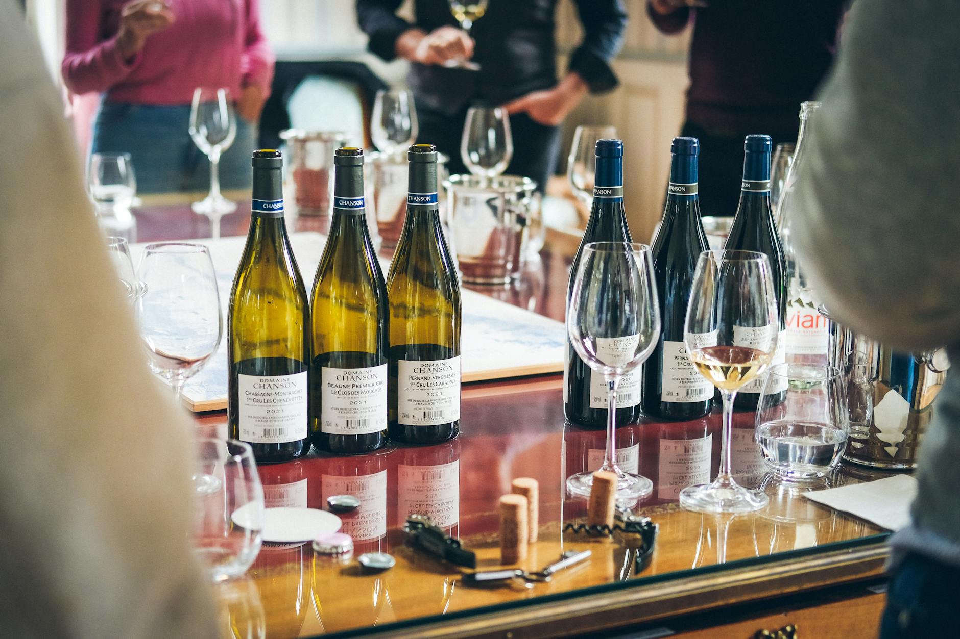 Wine tasting event with bottles and glasses on a table