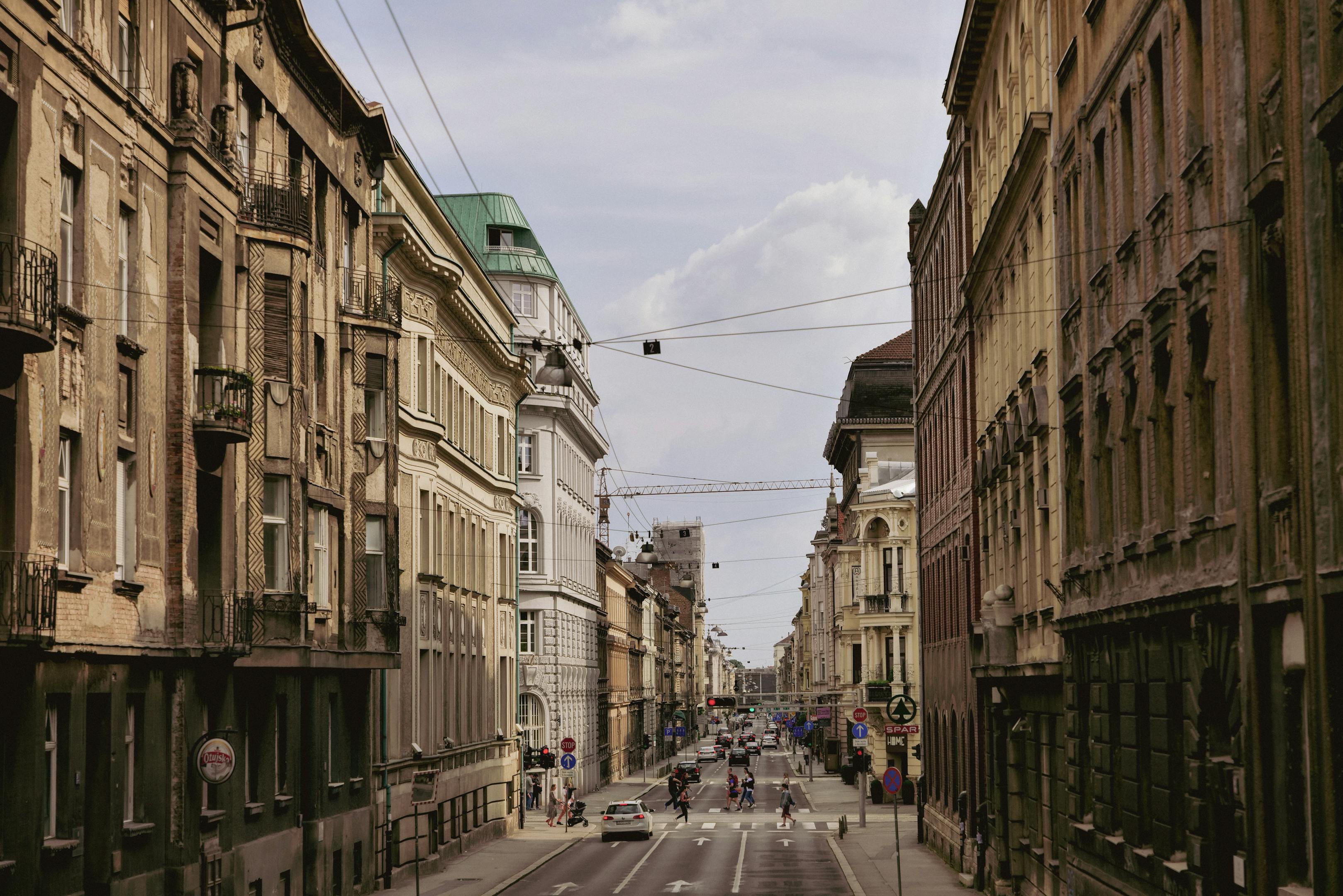 A vibrant street scene showcasing the historic architecture of Zagreb, Croatia's city center
