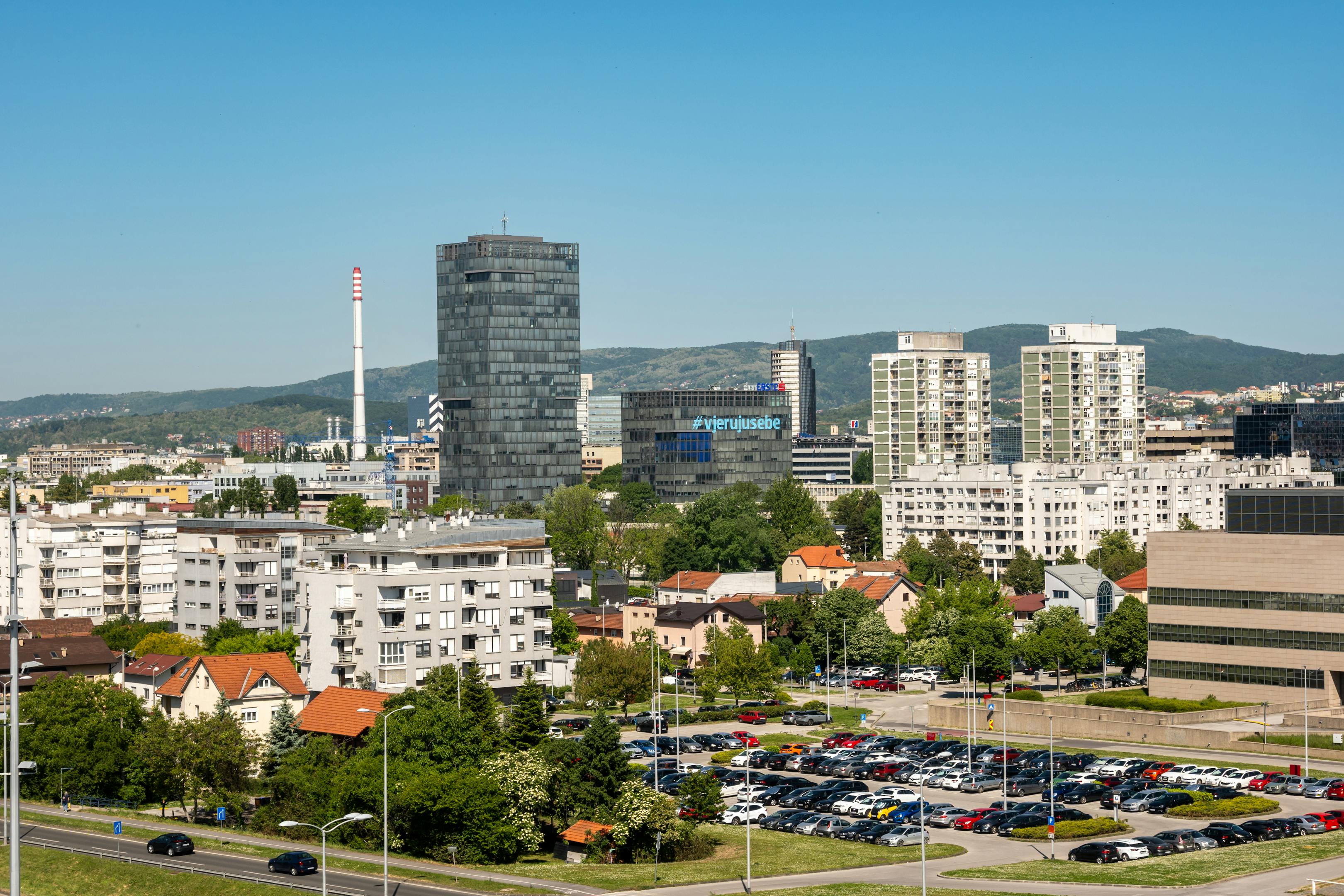 A vibrant urban scene in Zagreb with modern buildings and a bustling atmosphere